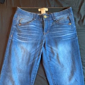 Two jeans one is a dark grey and the other is a dark blue